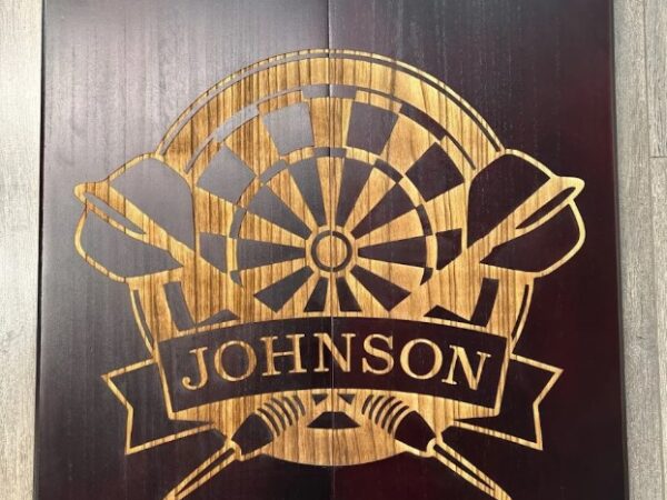 ALT: Custom laser engraved wooden dart cabinet door in Ottawa