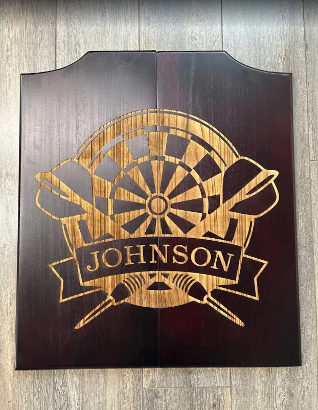 ALT: Custom laser engraved wooden dart cabinet door in Ottawa