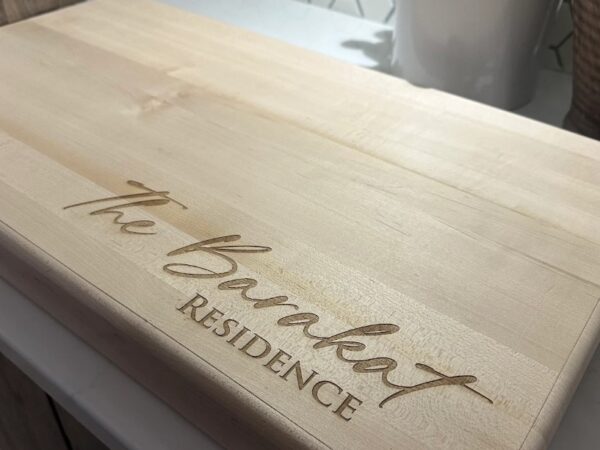 Custom laser engraved wooden Sweeney Residence sign in Ottawa