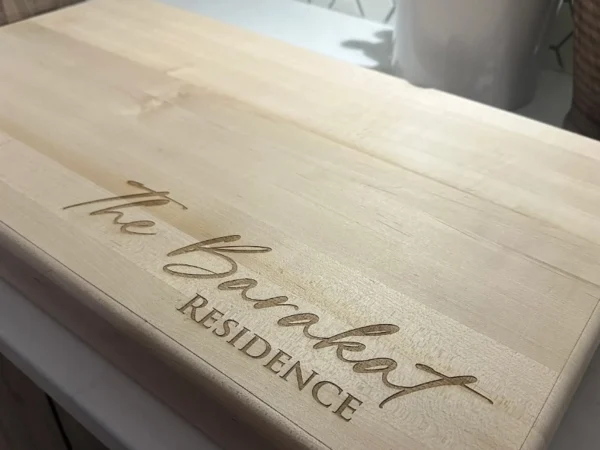 Custom laser engraved wooden Sweeney Residence sign in Ottawa