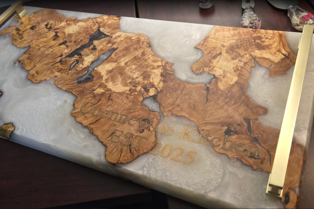 Custom laser engraving on live edge wood and epoxy resin table in Ottawa
