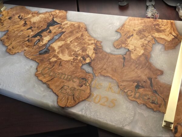 Custom laser engraving on live edge wood and epoxy resin table in Ottawa