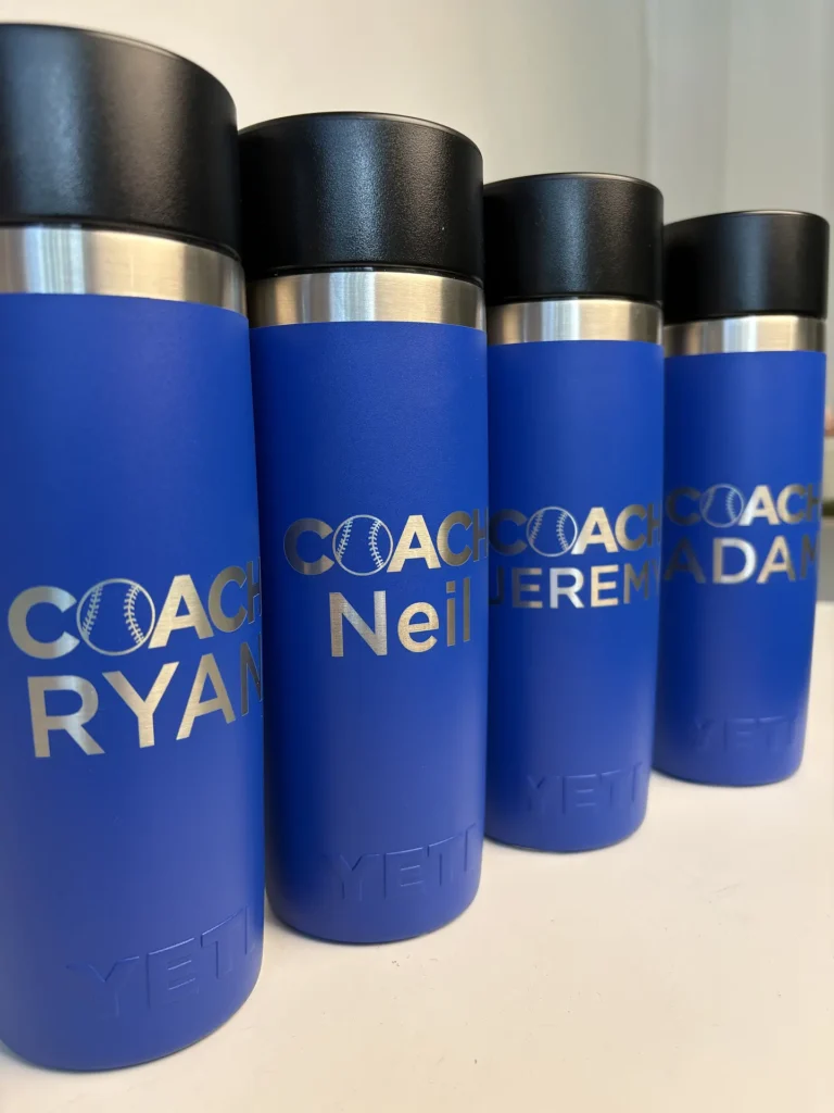 Coach tumbler engraving on blue YETI drinkware with personalized baseball names in Ottawa