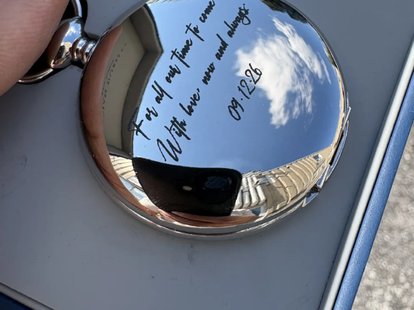 Pocket watch engraving with personalized message and date on polished metal in Ottawa