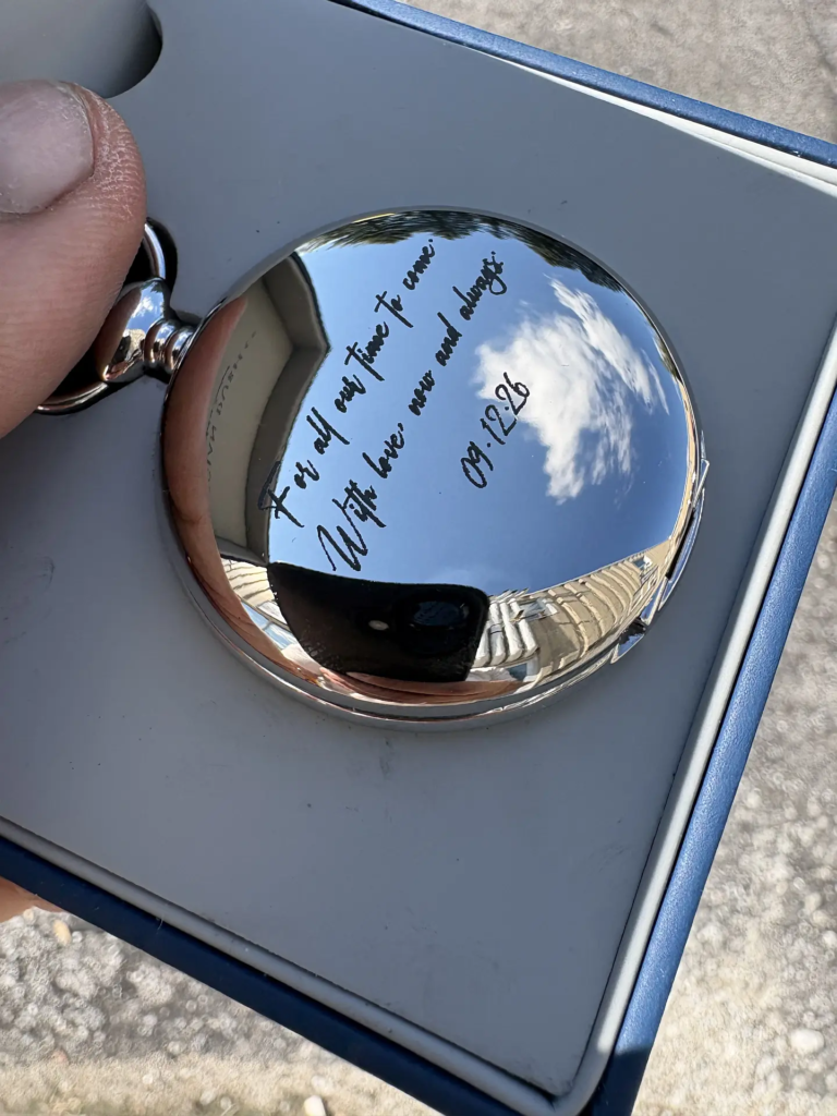 Pocket watch engraving with personalized message and date on polished metal in Ottawa